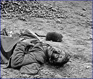 A dead soldier in Petersburg, Virginia 1865, photographed by Thomas C. Roche.